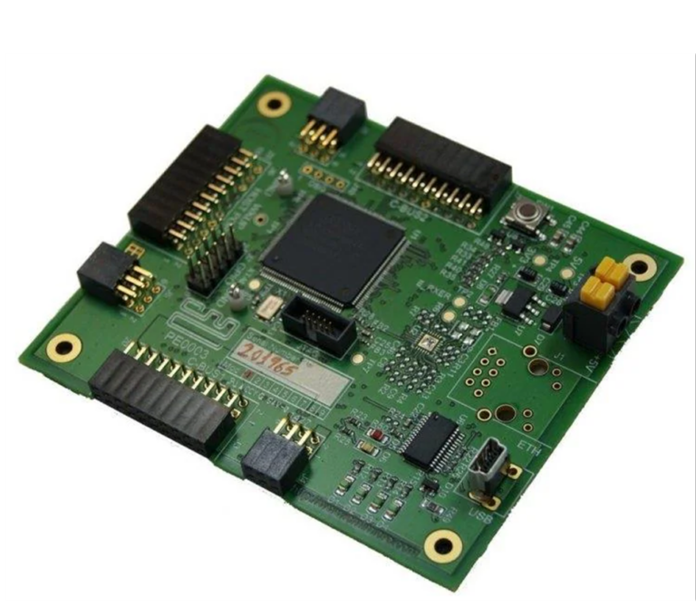 Photograph of the PE0003 development board showing C-BUS headers, a microcontroller, Ethernet and USB connectors, viewed at an angle